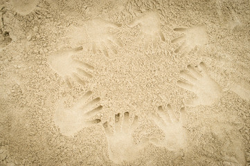 Hand prints in the sand
