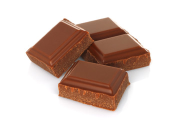 Broken chocolate bar isolated on white background .