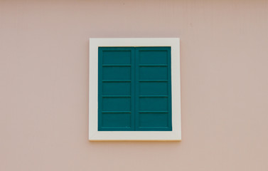 White window on a pink wall