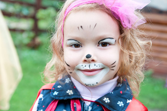 Adorable little girl with painted face