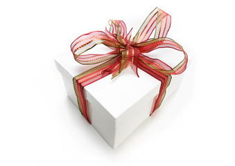 Christmas present wrapped with a red ribbon and bow.