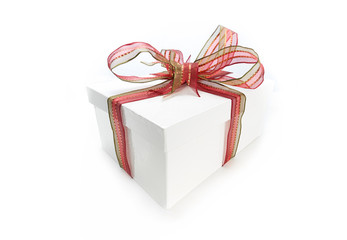 Christmas present wrapped with a red ribbon and bow.