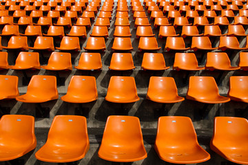 Naklejka premium Front of the orange seats on the stadium