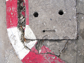 Damaged footpath and sad face