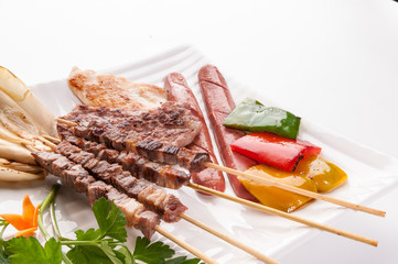 Grilled meat on white dish