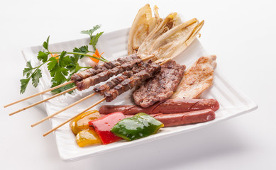 Grilled meat on white dish