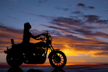 Naklejka na ściany i meble silhouette motorcycle woman side ride