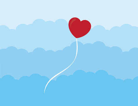 Heart balloon floating through the clouds