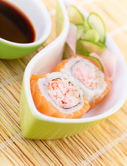 Tasty sushi with soy sauce