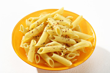 Cooked penne pasta on a plate