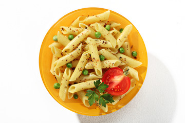 plate of cooked tubular pasta with seasoning herbs