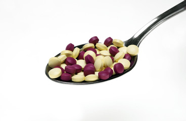Pills on spoon