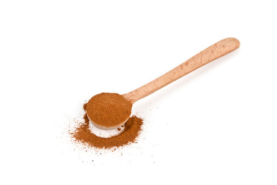 Ground Cinnamon In Wooden Spoon