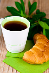 cup of tea and fresh croissant