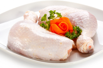Raw chicken legs on white background