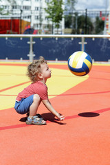 Toddler playing with ball