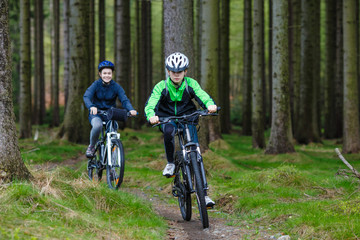 Healthy lifestyle - teenage girl and boy biking