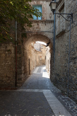 Fototapeta na wymiar Street with arch in an Italian village