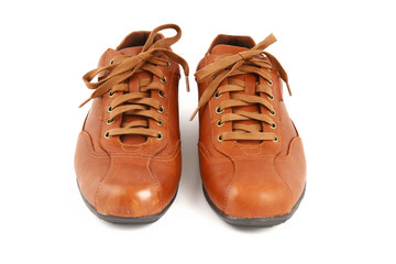 Brown leather men's shoes on white background.