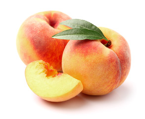 Ripe peaches with leaves