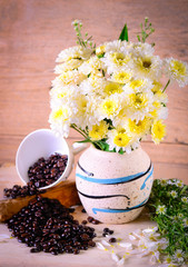 Tropical Still Life with Flower coffee pot over wood background