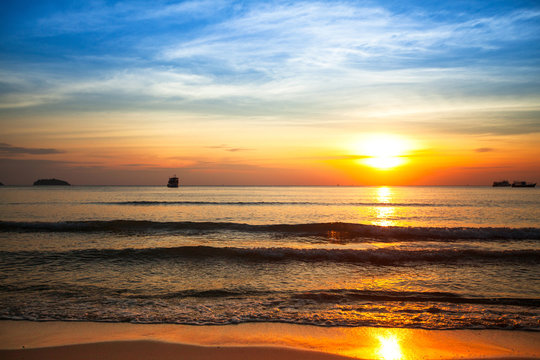 Fototapeta Beautiful sunset on the sea beach.