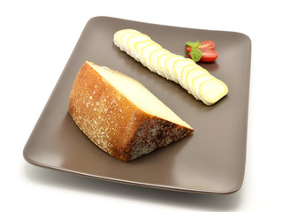 Pecorino di Pienza, italian sheep cheese and sliced ​​camembert