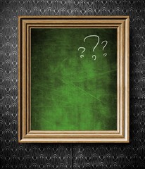 Question marks with copy-space chalkboard in old wooden frame