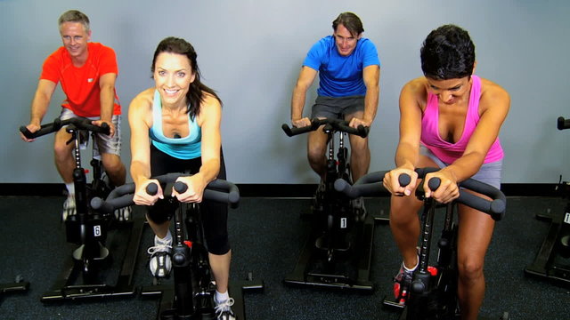 Multi Ethnic Gym Members Working Out