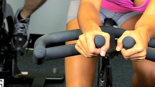 Ethnic Member Fitness Club Exercise Bike Hands Legs