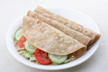 Vegetarian sandwich, chapati with fesh vegetables.
