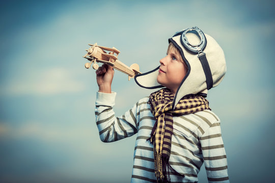 Boy with wooden plane