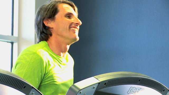 Male Exercising Health Club Equipment Close Up 
