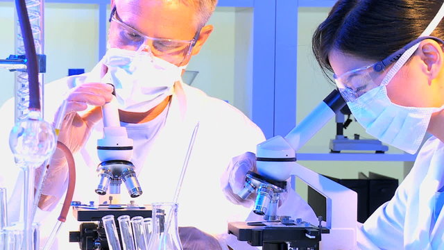 Multi Ethnic Medical Technicians Laboratory Equipment