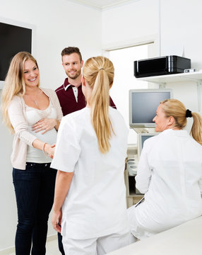 Expectant Couple Visiting Gynecologist
