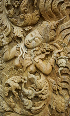 Fototapeta na wymiar Pattern of god carved on wood