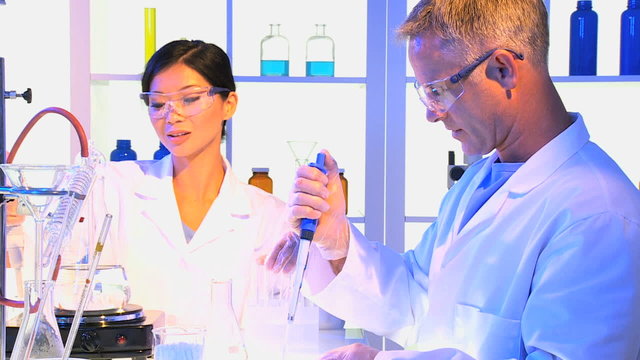 Multi Ethnic Medical Technicians Laboratory Equipment