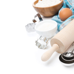 rolling pin, measuring spoons, cookie cutters, baking ingredient
