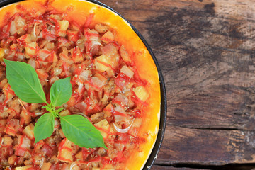 Fresh pizza on a wooden board