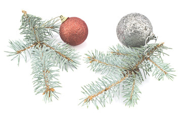 Christmas balls and pine needles isolated on white
