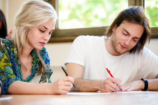 Female and male student at class