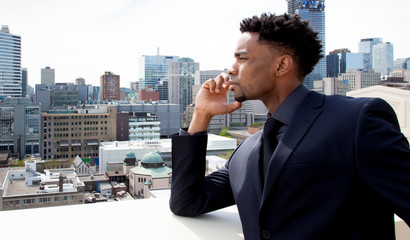 Attractive afro-american business man posing in studio