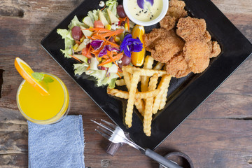 fried chicken with fries on a plate