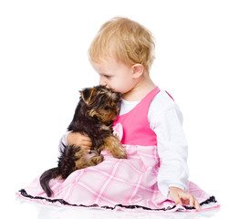 girl hug a little Yorkshire Terrier  puppy. isolated on white 