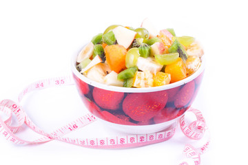 Plate of a tasty cuted fruits isolated on a white background wit