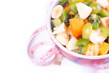 Plate of a tasty cuted fruits isolated on a white background wit