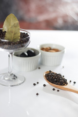 Different spices over a dark wood