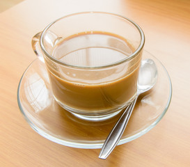 hot Coffee on the wooden table in the morning time