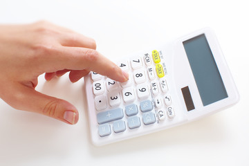 Hand with calculator.