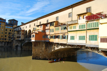 Fototapeta na wymiar Sportsmen in canoe in Florence